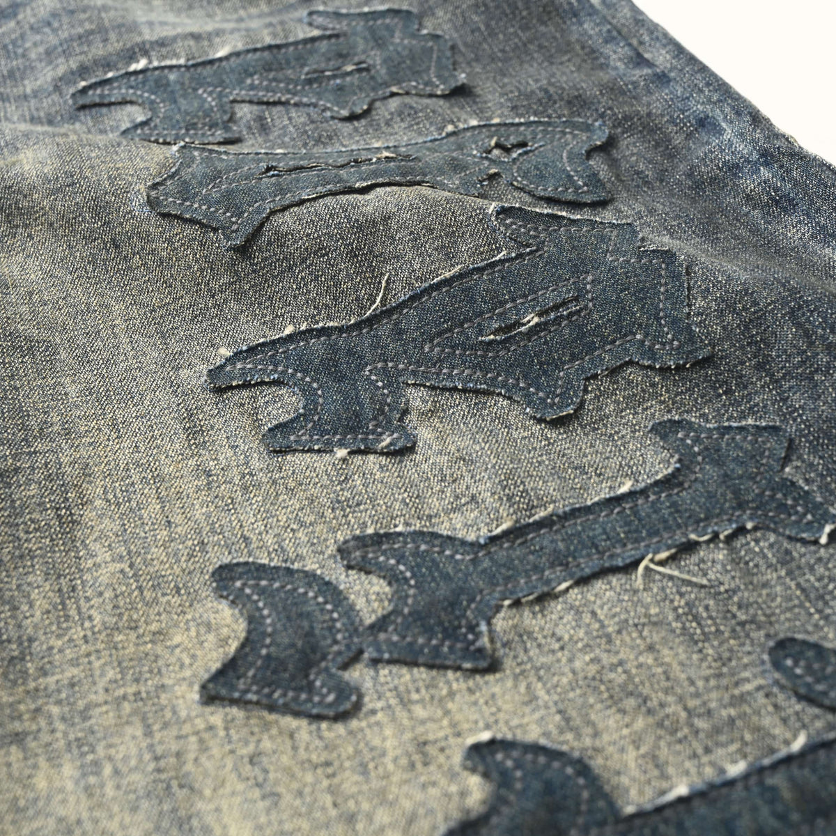 BALENCIAGA BLCG Distressed Jeans with Leg Appliques